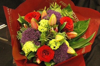 Bouquet of red naomi roses, purple trachelium, viburnum snowball and deep pink Oriental Lilies, mixed with foliage